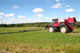 Applying biocontrol nematodes to an alfalfa field in northern NY. Adapted ATVs and other on-farm equipment are also used to apply the combination of two native NY species of nematodes that NNYADP-funded research has proven can successfully reduce alfalfa beetle populations. Photo: NNYADP